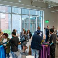 Photo of guests mingling in room